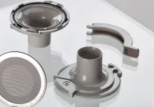 medical components are displayed on a glass table